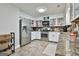 Modern kitchen with stainless steel appliances, stone countertops, and plenty of storage space at 1234 Coweta Heard Rd, Hogansville, GA 30230