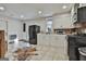 Bright kitchen featuring white cabinets, modern appliances, and ample counter space at 1234 Coweta Heard Rd, Hogansville, GA 30230