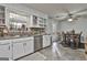 Bright kitchen area featuring tile floors, stone counters and stainless steel appliances, naturally lit at 1234 Coweta Heard Rd, Hogansville, GA 30230
