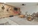 Cozy living room showcasing wood paneling, comfortable seating, and stylish interior design at 1234 Coweta Heard Rd, Hogansville, GA 30230