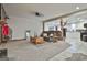 Spacious living room featuring plush carpeting, a comfortable sofa, and unique decor at 1234 Coweta Heard Rd, Hogansville, GA 30230
