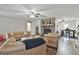 Cozy living room with stone fireplace, hardwood floors, and classic leather seating arrangement at 1234 Coweta Heard Rd, Hogansville, GA 30230