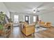 Bright living room with hardwood floors and comfortable leather seating, perfect for relaxation at 1234 Coweta Heard Rd, Hogansville, GA 30230