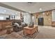 Comfortable living room with a plush sofa, rustic decor, and an open floor plan at 1234 Coweta Heard Rd, Hogansville, GA 30230