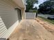 Back patio with sliding glass doors and a white fence at 1466 Pine Log Ne Rd # A, Conyers, GA 30012