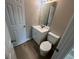 Fresh bathroom with modern fixtures, white vanity, and a large mirror over the sink at 1466 Pine Log Ne Rd # A, Conyers, GA 30012