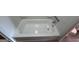 Clean bathroom featuring white porcelain tub at 1466 Pine Log Ne Rd # A, Conyers, GA 30012