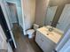 Bathroom featuring a white vanity, sink and toilet at 1466 Pine Log Ne Rd # A, Conyers, GA 30012
