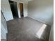 Bedroom with closet and bathroom access, carpet and neutral walls at 1466 Pine Log Ne Rd # A, Conyers, GA 30012