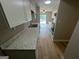 Bright kitchen featuring white cabinets, marbled countertops, and stainless steel appliances at 1466 Pine Log Ne Rd # A, Conyers, GA 30012
