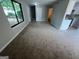 Spacious living room showcasing new carpet, fresh paint, and open access to the kitchen at 1466 Pine Log Ne Rd # A, Conyers, GA 30012