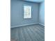 Carpeted bedroom featuring a window with blinds and neutral wall paint at 1715 Crumbley Rd # 2, Mcdonough, GA 30252