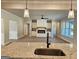 Open concept living room flowing from kitchen with a hardwood floor and a fireplace as a focal point at 1715 Crumbley Rd # 2, Mcdonough, GA 30252