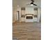 Cozy living room featuring hardwood floors and a modern fireplace with built-in cabinets at 1715 Crumbley Rd # 2, Mcdonough, GA 30252