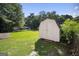 The backyard features a utility shed and a large grassy lawn at 6369 Havenridge Dr, Riverdale, GA 30274