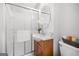 Bathroom features updated vanity, sink, faucet, mirror and sliding glass door shower at 6369 Havenridge Dr, Riverdale, GA 30274