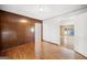 Bedroom showcases wood paneling, flooring, and an open doorway to an adjoining living space at 6369 Havenridge Dr, Riverdale, GA 30274