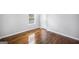 Cozy bedroom offers hardwood floors, a window, and a closet door at 6369 Havenridge Dr, Riverdale, GA 30274
