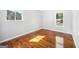 Bedroom featuring hardwood floors and windows with backyard view at 6369 Havenridge Dr, Riverdale, GA 30274
