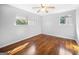 Sun-filled bedroom boasts gleaming hardwood floors and a ceiling fan at 6369 Havenridge Dr, Riverdale, GA 30274