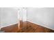 Bedroom featuring wood floors and neutral paint, with doorway to hall at 6369 Havenridge Dr, Riverdale, GA 30274