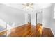 Large bedroom features hardwood floors, neutral walls, a ceiling fan, and two closets at 6369 Havenridge Dr, Riverdale, GA 30274