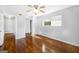 Bedroom featuring hardwood floors, neutral walls, and a ceiling fan with two windows at 6369 Havenridge Dr, Riverdale, GA 30274