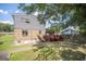 Exterior view showing the back of the house and a red painted deck at 6369 Havenridge Dr, Riverdale, GA 30274