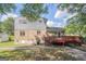 Exterior view showing the back of the house and a red painted deck at 6369 Havenridge Dr, Riverdale, GA 30274