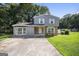 Charming home showcasing a two-story layout and welcoming front yard at 6369 Havenridge Dr, Riverdale, GA 30274