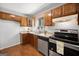 Kitchen with new countertops, new stainless steel dishwasher, wood cabinets, and tile floors at 6369 Havenridge Dr, Riverdale, GA 30274