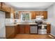 Updated kitchen with modern stainless steel appliances, granite countertops, and decorative wood cabinets at 6369 Havenridge Dr, Riverdale, GA 30274