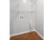 Laundry room with wire shelving and tile flooring. The walls are painted in light grey at 6369 Havenridge Dr, Riverdale, GA 30274