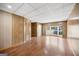 Spacious living room featuring wood paneling and flooring, and a bay window at 6369 Havenridge Dr, Riverdale, GA 30274