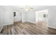 Open living room featuring modern vinyl flooring, fan, and neutral colors at 6369 Havenridge Dr, Riverdale, GA 30274