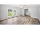 Bright living room with windows, modern vinyl flooring, and neutral colors at 6369 Havenridge Dr, Riverdale, GA 30274