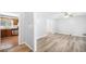 Living room showcasing vinyl flooring, with view into kitchen at 6369 Havenridge Dr, Riverdale, GA 30274