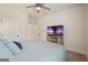 Cozy bedroom with soft, neutral decor and a large window for natural light at 6915 Rambling Vale, Cumming, GA 30028