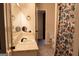 Bathroom vanity with a large mirror and seashell-themed shower curtain at 8039 Woods Ln, Jonesboro, GA 30236