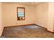 Bedroom featuring a window, neutral walls, and carpet flooring at 8039 Woods Ln, Jonesboro, GA 30236