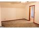 Cozy bedroom with neutral walls, carpet, and an angled ceiling at 8039 Woods Ln, Jonesboro, GA 30236