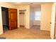 Bedroom with an open closet, plush carpeting, and natural light at 8039 Woods Ln, Jonesboro, GA 30236