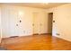 Spacious bedroom featuring hardwood floors and neutral walls at 8039 Woods Ln, Jonesboro, GA 30236