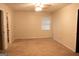 View of bedroom with plush carpet, neutral walls, and a ceiling fan at 8039 Woods Ln, Jonesboro, GA 30236
