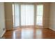 Sunlit dining area with laminate floors, and large windows with views of the outside at 8039 Woods Ln, Jonesboro, GA 30236