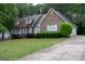 Charming brick home with well-maintained landscaping and a spacious driveway at 8039 Woods Ln, Jonesboro, GA 30236