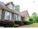 Attractive brick home with manicured bushes and a beautifully landscaped front yard at 8039 Woods Ln, Jonesboro, GA 30236