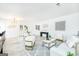 Open-concept living and dining area with modern decor, comfortable seating, and stylish accents at 8479 Alden Dr, Riverdale, GA 30274
