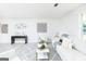 Bright and airy living room featuring stylish decor, neutral furnishings, and ample natural light at 8479 Alden Dr, Riverdale, GA 30274