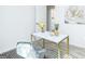 Home office showcasing a white marble desk with gold trim and decor, plus a comfortable chair at 8479 Alden Dr, Riverdale, GA 30274
